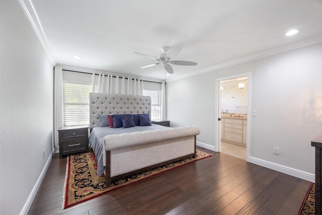 bedroom with ornamental molding, dark hardwood / wood-style flooring, ceiling fan, and connected bathroom