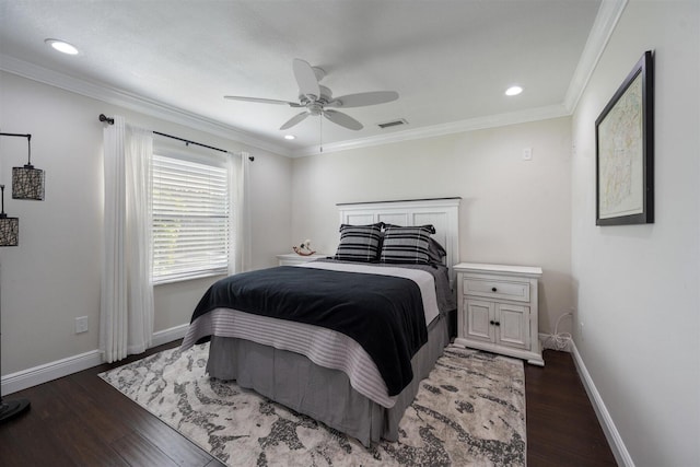 bedroom with crown molding, ceiling fan, and dark hardwood / wood-style floors