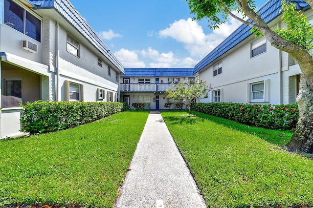 view of community featuring a yard