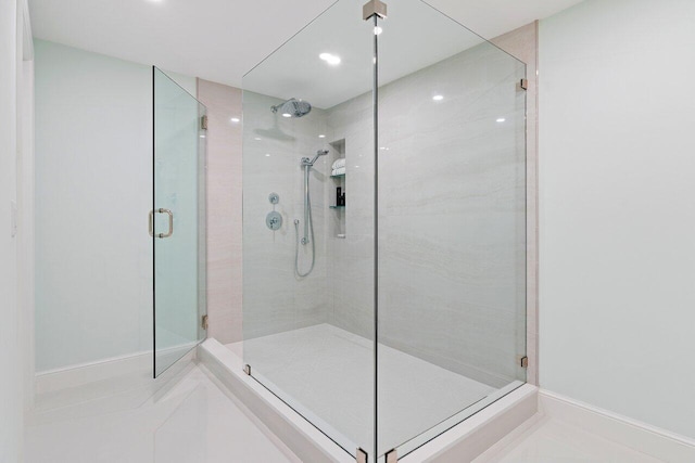 bathroom featuring tile patterned flooring and walk in shower