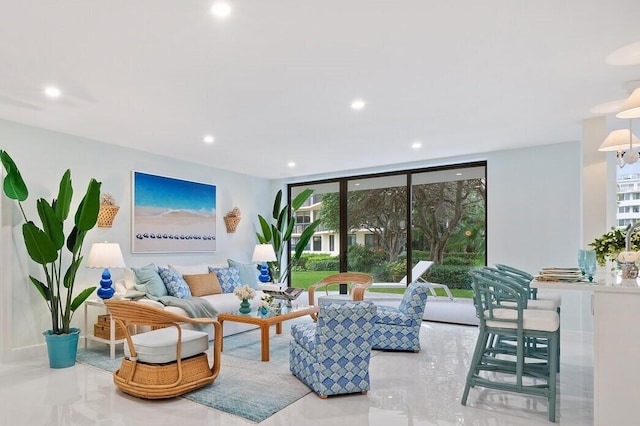 living room featuring recessed lighting and floor to ceiling windows