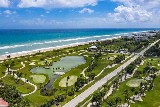 drone / aerial view featuring a view of the beach and a water view