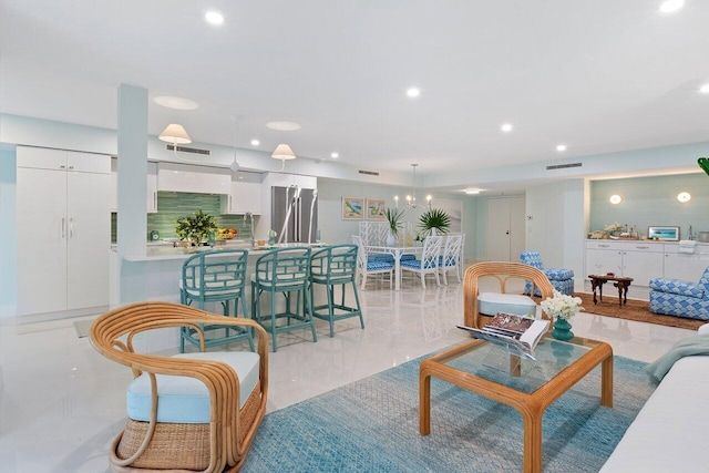 living room with recessed lighting and visible vents