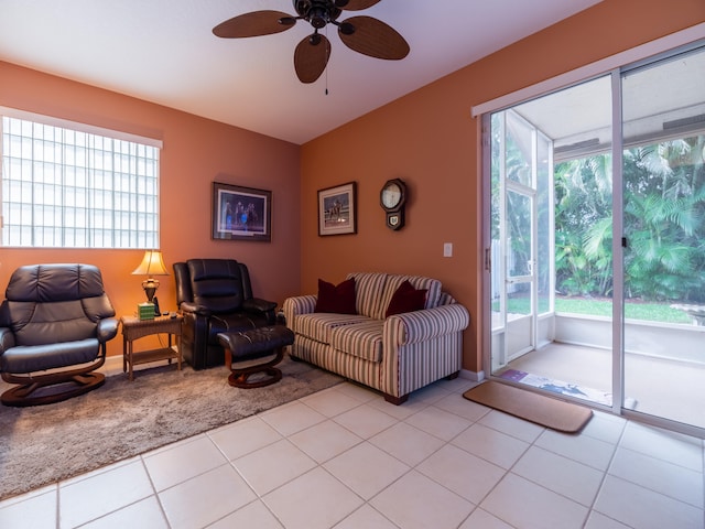 living room with ceiling fan and light tile patterned floors