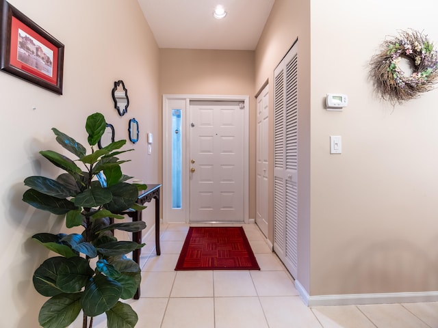 entryway with light tile patterned floors