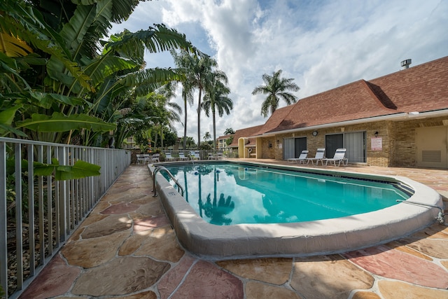 view of swimming pool featuring a patio area