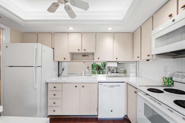 kitchen with white appliances, dark hardwood / wood-style flooring, ornamental molding, sink, and ceiling fan