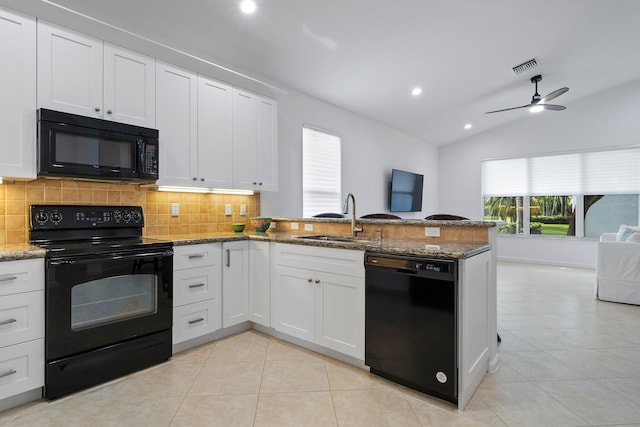 kitchen with white cabinetry, ceiling fan, lofted ceiling, and black appliances