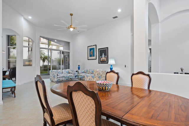 tiled dining area featuring ceiling fan