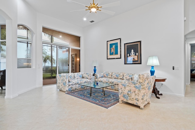 tiled living room featuring ceiling fan