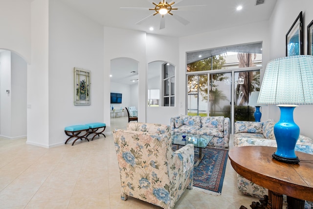 living room with light tile patterned floors and ceiling fan