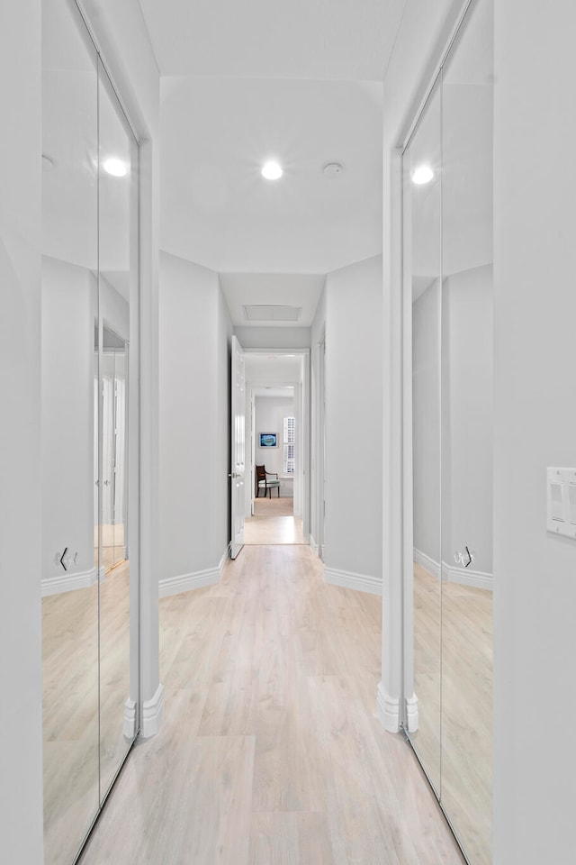 corridor featuring light hardwood / wood-style flooring