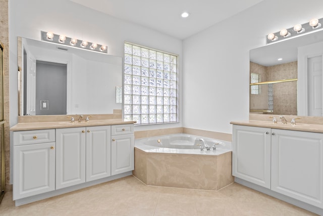 bathroom featuring tile patterned flooring, vanity, and independent shower and bath