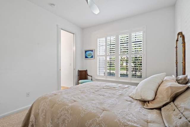 bedroom with ceiling fan and carpet floors