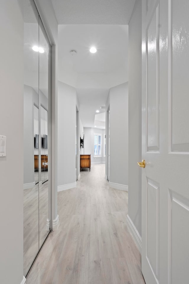 corridor featuring light hardwood / wood-style floors