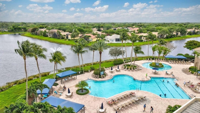 view of swimming pool featuring a water view