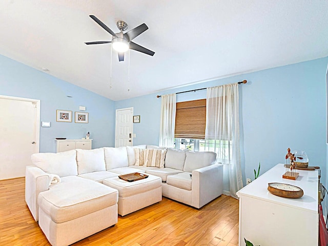222 SW Starfish Ave, Port Saint Lucie, FL 34984 - living room with lofted ceiling, light wood finished floors, and ceiling fan