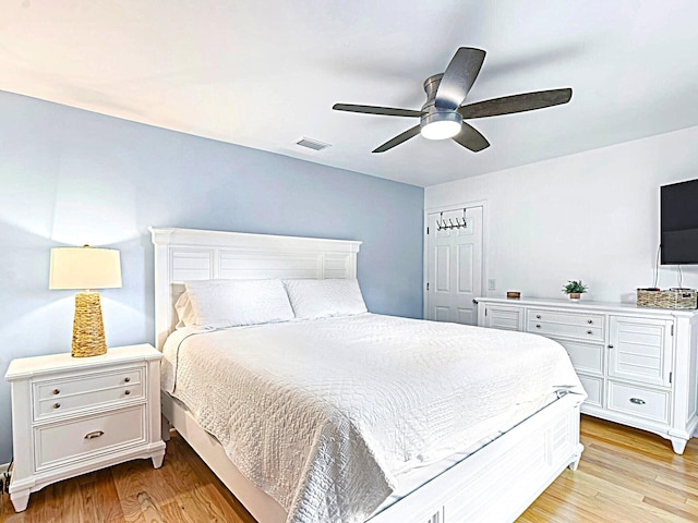 bedroom featuring light wood-type flooring and ceiling fan