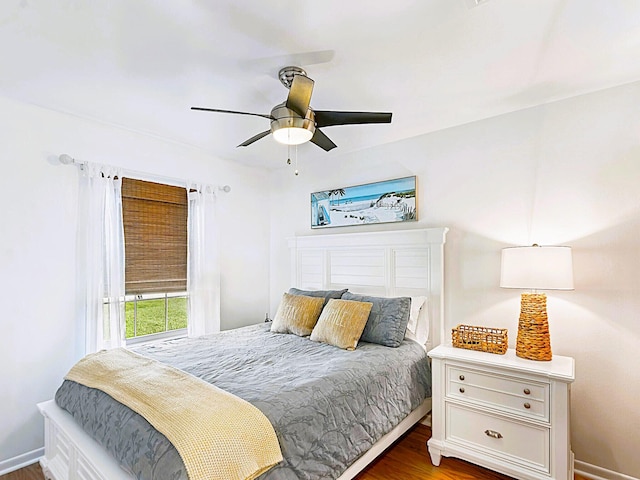 bedroom with ceiling fan and wood-type flooring