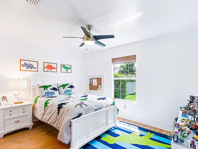 bedroom featuring ceiling fan and light hardwood / wood-style floors