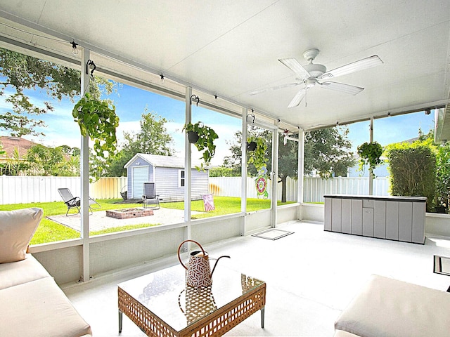 sunroom featuring ceiling fan