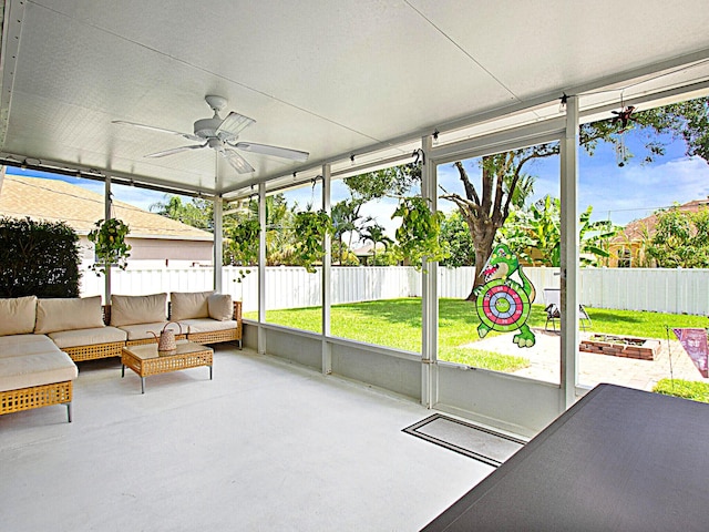 sunroom / solarium with ceiling fan