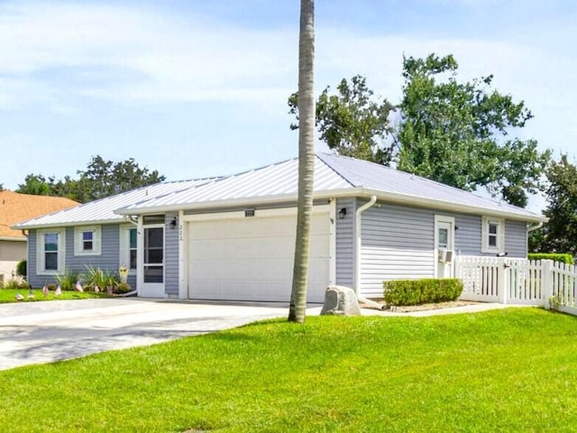 view of front facade with a garage and a front yard