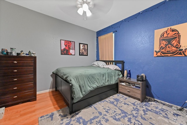 bedroom featuring ceiling fan and wood-type flooring