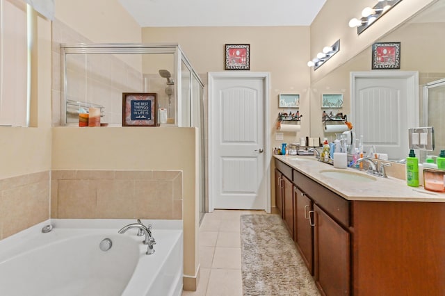 bathroom featuring tile patterned floors, separate shower and tub, and vanity