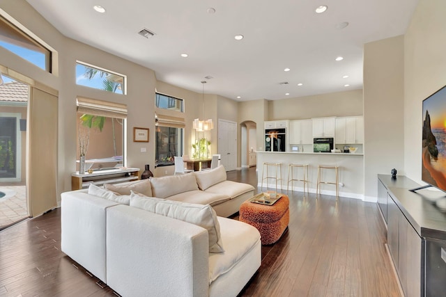 16106 Rosecroft Ter, Delray Beach, FL 33446 - living area featuring recessed lighting, a high ceiling, visible vents, dark wood finished floors, and arched walkways