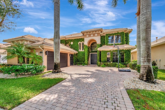 mediterranean / spanish-style home featuring a garage