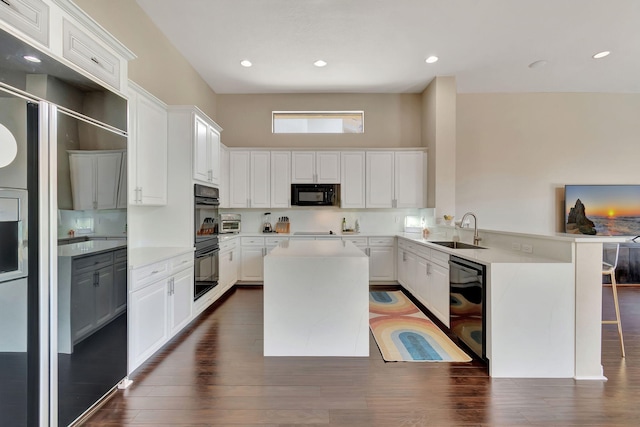 16106 Rosecroft Ter, Delray Beach, FL 33446 - kitchen with white cabinets, a sink, light countertops, a peninsula, and black appliances