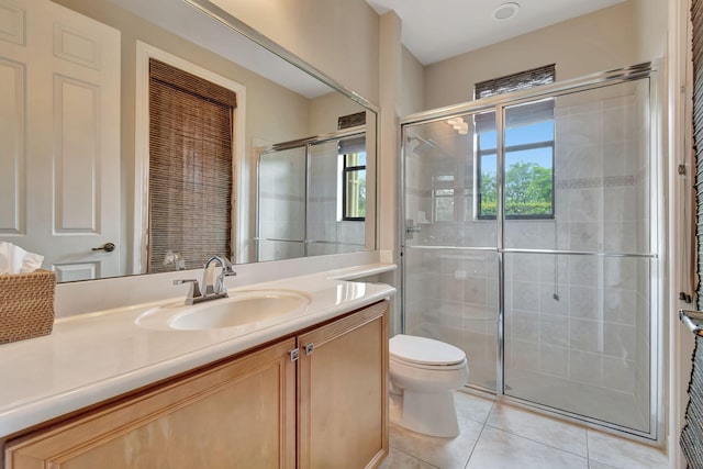 16106 Rosecroft Ter, Delray Beach, FL 33446 - bathroom featuring toilet, tile patterned flooring, vanity, and a stall shower