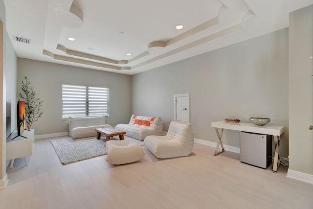 16106 Rosecroft Ter, Delray Beach, FL 33446 - living area featuring a tray ceiling, wood finished floors, visible vents, and recessed lighting