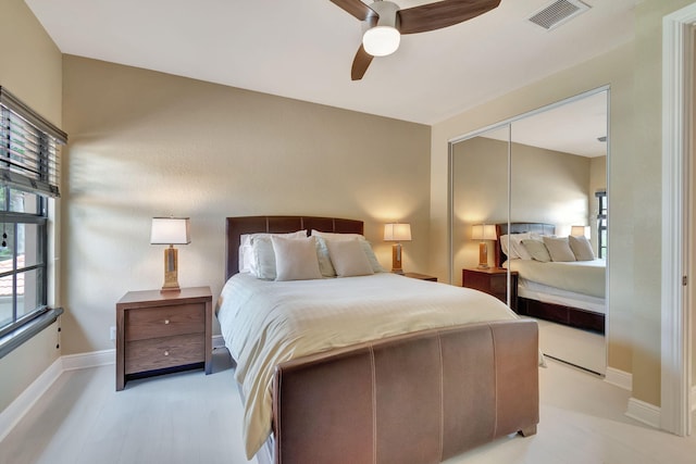 bedroom featuring a closet, ceiling fan, and light hardwood / wood-style flooring