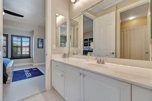 bathroom with vanity, ceiling fan, and tile patterned floors