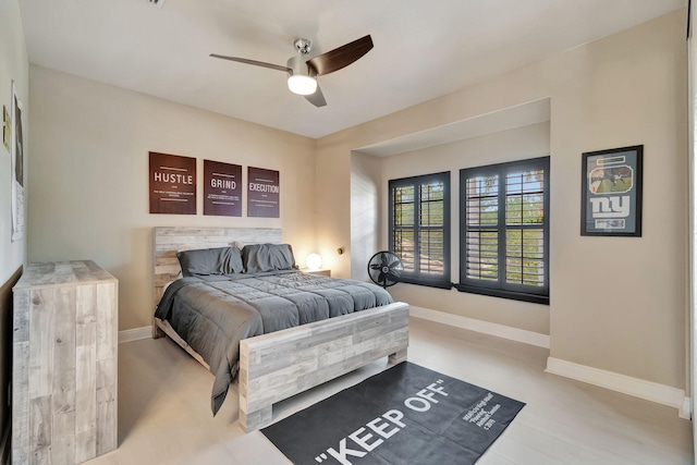 bedroom featuring ceiling fan and light hardwood / wood-style floors