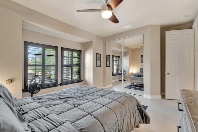 16106 Rosecroft Ter, Delray Beach, FL 33446 - bedroom featuring a closet, multiple windows, baseboards, and ceiling fan