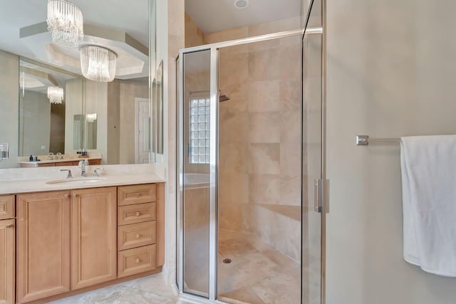 16106 Rosecroft Ter, Delray Beach, FL 33446 - bathroom with an inviting chandelier, a stall shower, and vanity
