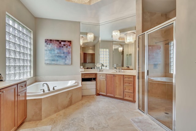 bathroom featuring vanity and separate shower and tub