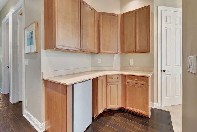 16106 Rosecroft Ter, Delray Beach, FL 33446 - kitchen with dark wood-style flooring, light countertops, and fridge