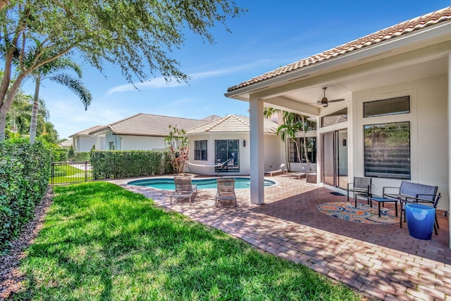 16106 Rosecroft Ter, Delray Beach, FL 33446 - view of swimming pool featuring a ceiling fan, a lawn, fence, a patio, and a fenced in pool