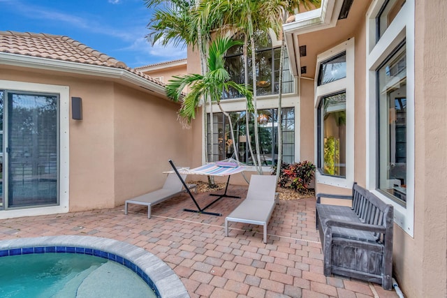 view of patio / terrace featuring a swimming pool