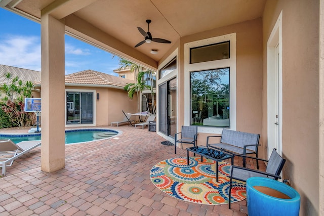 view of patio featuring ceiling fan