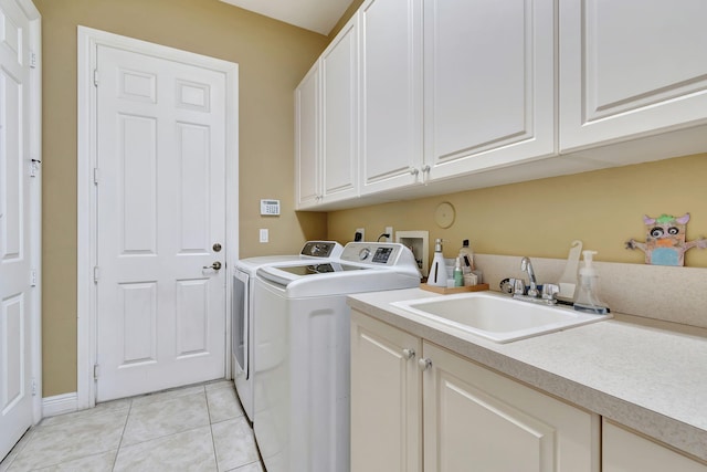 16106 Rosecroft Ter, Delray Beach, FL 33446 - clothes washing area featuring washing machine and clothes dryer, a sink, cabinet space, and light tile patterned floors
