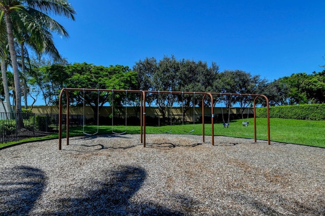 view of jungle gym featuring a lawn