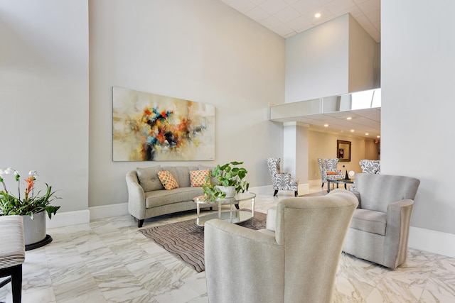 living room with a towering ceiling