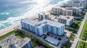 birds eye view of property featuring a view of the beach and a water view