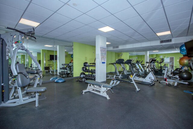 workout area with a drop ceiling