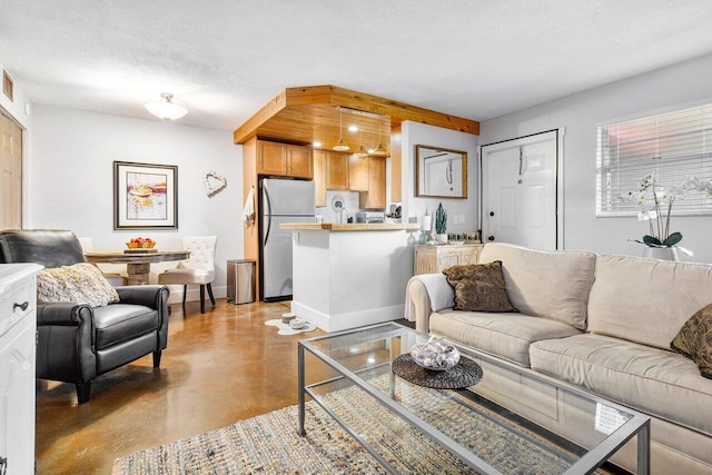 living room with a textured ceiling